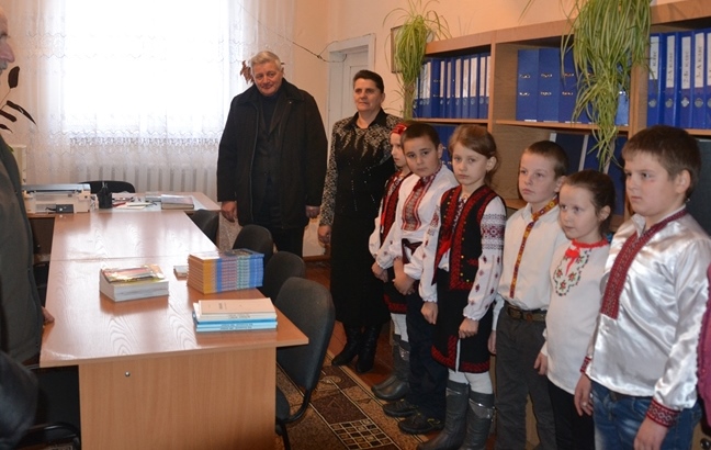 головна